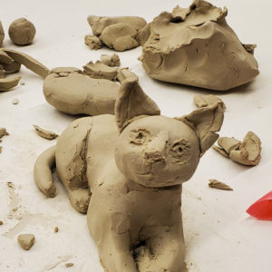 a child's clay sculpture of a cat